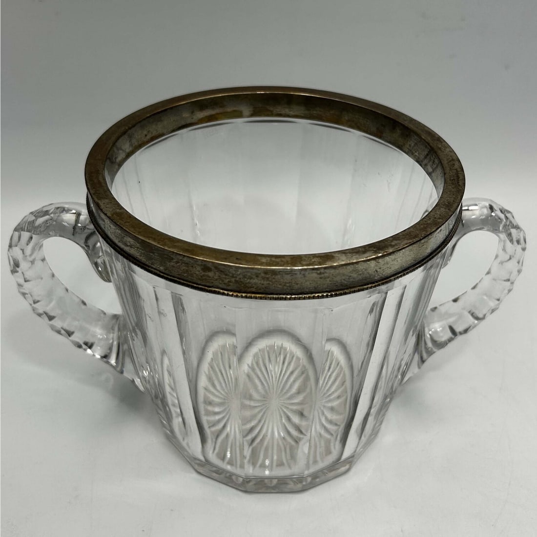 Antique Sterling Silver Rimmed Cut Glass Bucket: Antique Sterling Silver Rimmed Cut Glass 2-Handled Bucket. Fully Marked. Condition: Generally Very Good. Dimensions: H-5.25" x Dia-8.25". Provenance: From a Long Island, NY Home.Please note the absenc