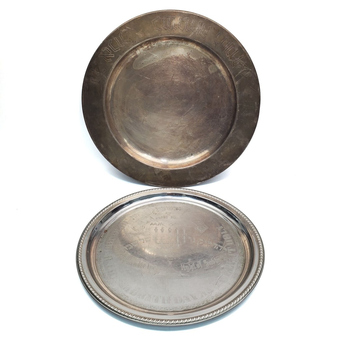 Judaica Lot of 2 Trays: Judaica Lot of 2 Trays. 1 is Silver Plated w/ Hebrew Writing & 1 Has Hebrew Writing & "Birth of Jewish State May, 15 1948". Condition: Generally Good. As Found. Dimensions: Larger Dia-14". Provenance: