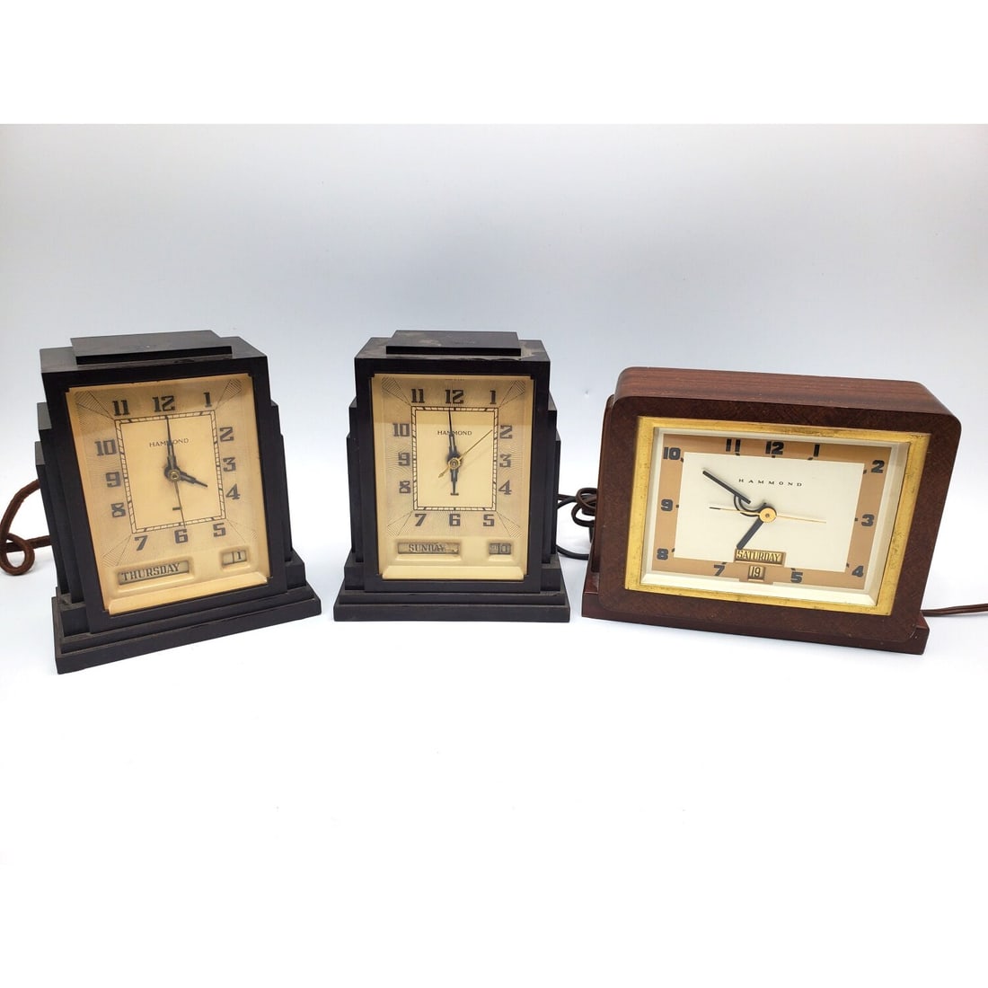 Pair of Hammond Gregory Art Deco Clocks: Pair of Hammond Gregory Art Deco Skyscraper Bakelite Clocks. Along w/ Another Hammond Alarm Clock. All Are c.1930's. Condition: Generally Good. Please Note- We Do Not Guarantee the Workability of Old 