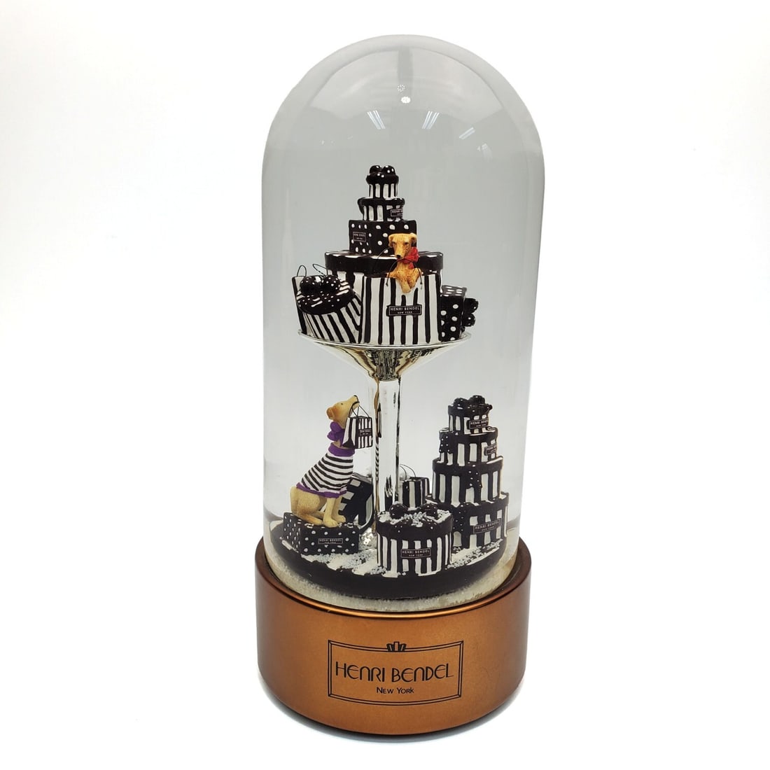 2010 Henri Bendel "Puppy Martini" Snowglobe: 2010 Henri Bendel "Puppy Martini" Musical Snow Globe.Condition: Generally Very Good. Dimensions: H-9". Provenance: From a Long Island, NY Home. Please note the absence of a Condition Report does not i