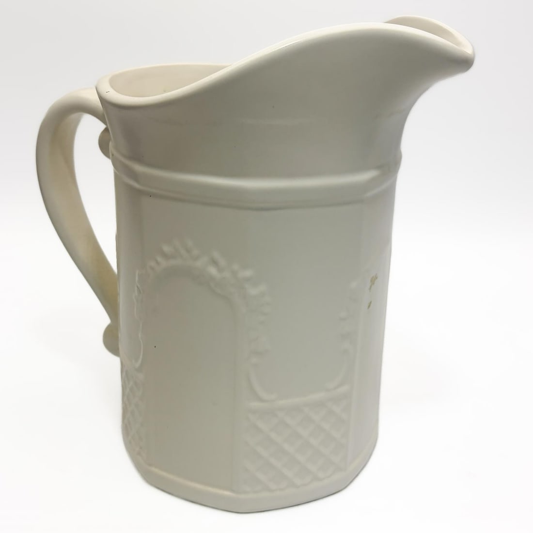 White Ceramic Pfaltzgraff Pitcher: White Ceramic Pfaltzgraff Pitcher. Marked on The Bottom. Condition: Generally Good. Dimensions: H- 9" x Dia of Bottom 5.5". Provenance: From a Long Island, NY Home. Please note the absence of a Condit