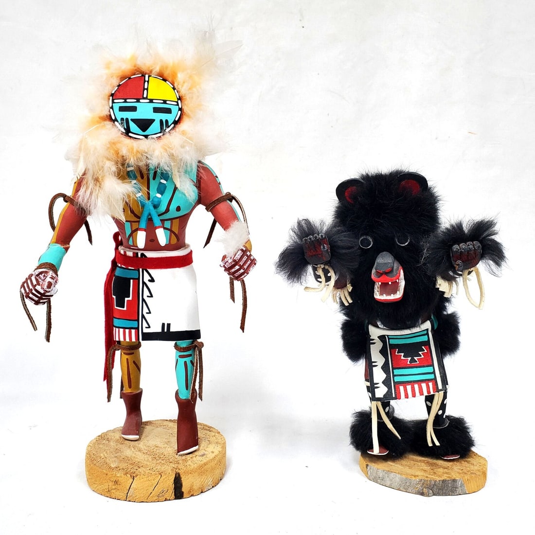 Lot of 2 Hopi Kachina Dolls: Lot of 2 Hopi Kachina Dolls. "Black Bear" By Francis Largo & "Sunface" Signed M.G. Both Are Signed & Titled on The Bottom of The Base. Condition: Generally Good. Dimensions: Taller H- 14". Provenance: