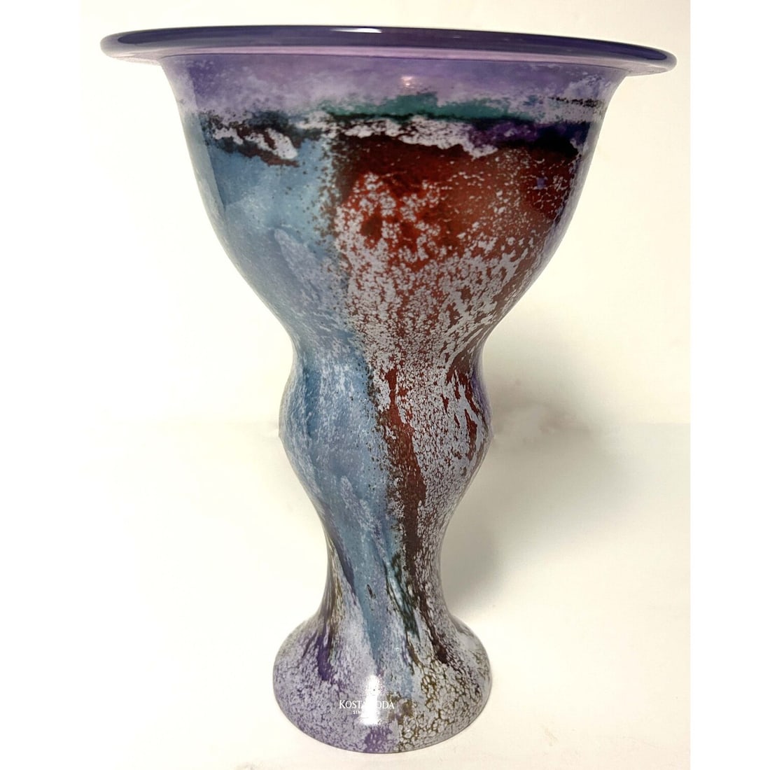 Kosta Boda Swedish Art Glass Vase: Kosta Boda Swedish Art Glass Vase. Signed on the Bottom.Condition: Generally Very Good. Dimensions: Dia-6.6" x H-8.75". Provenance: From a Long Island, NY Home. Please note the absence of a Condition 