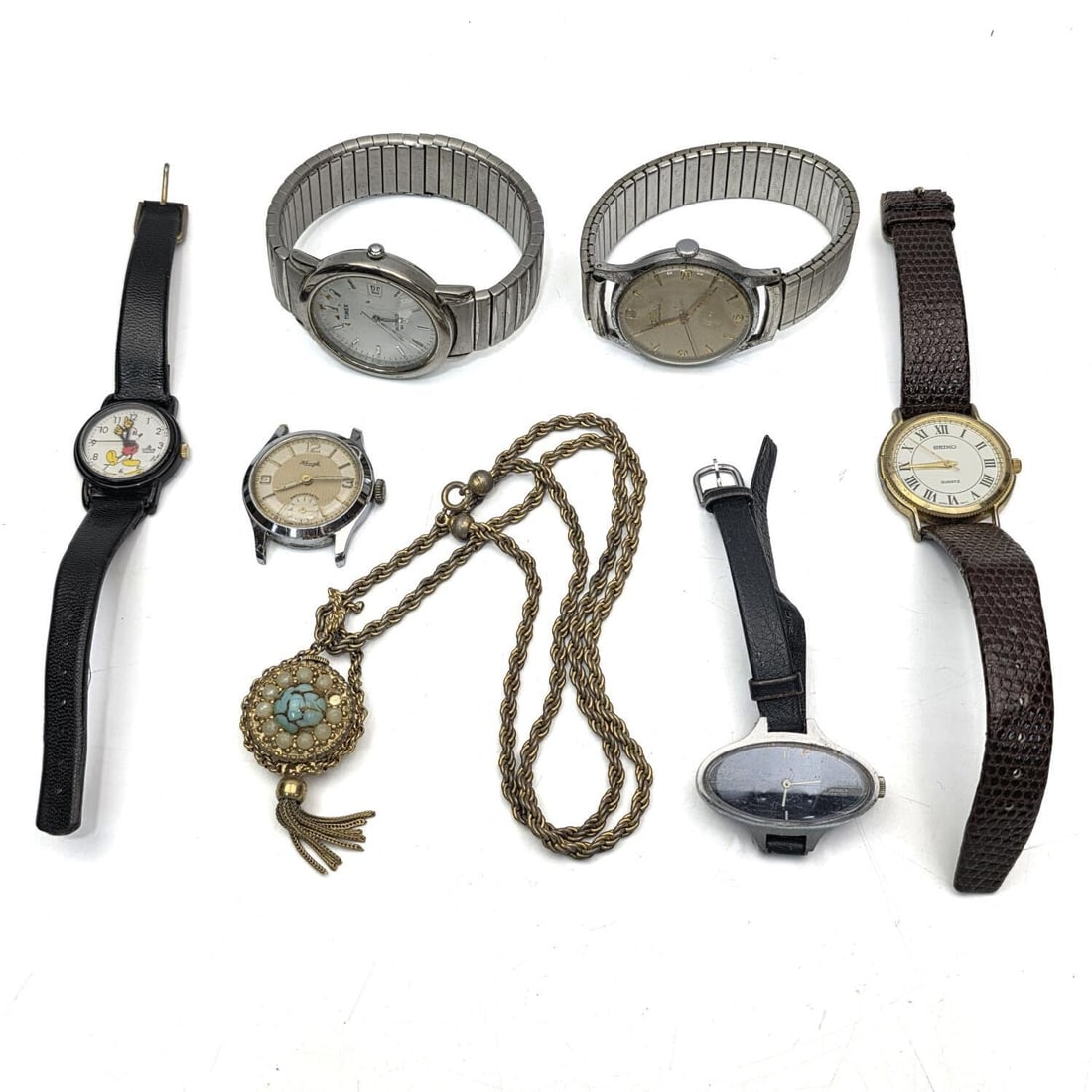 Bag Lot of Vintage Watches: Bag Lot of Vintage Watches Including an Old Mickey Mouse Pocket Watch. Condition: As Found.Dimensions: Various Sizes.Provenance: From a Long Island, NY Home. Please note the absence of a Condition Rep