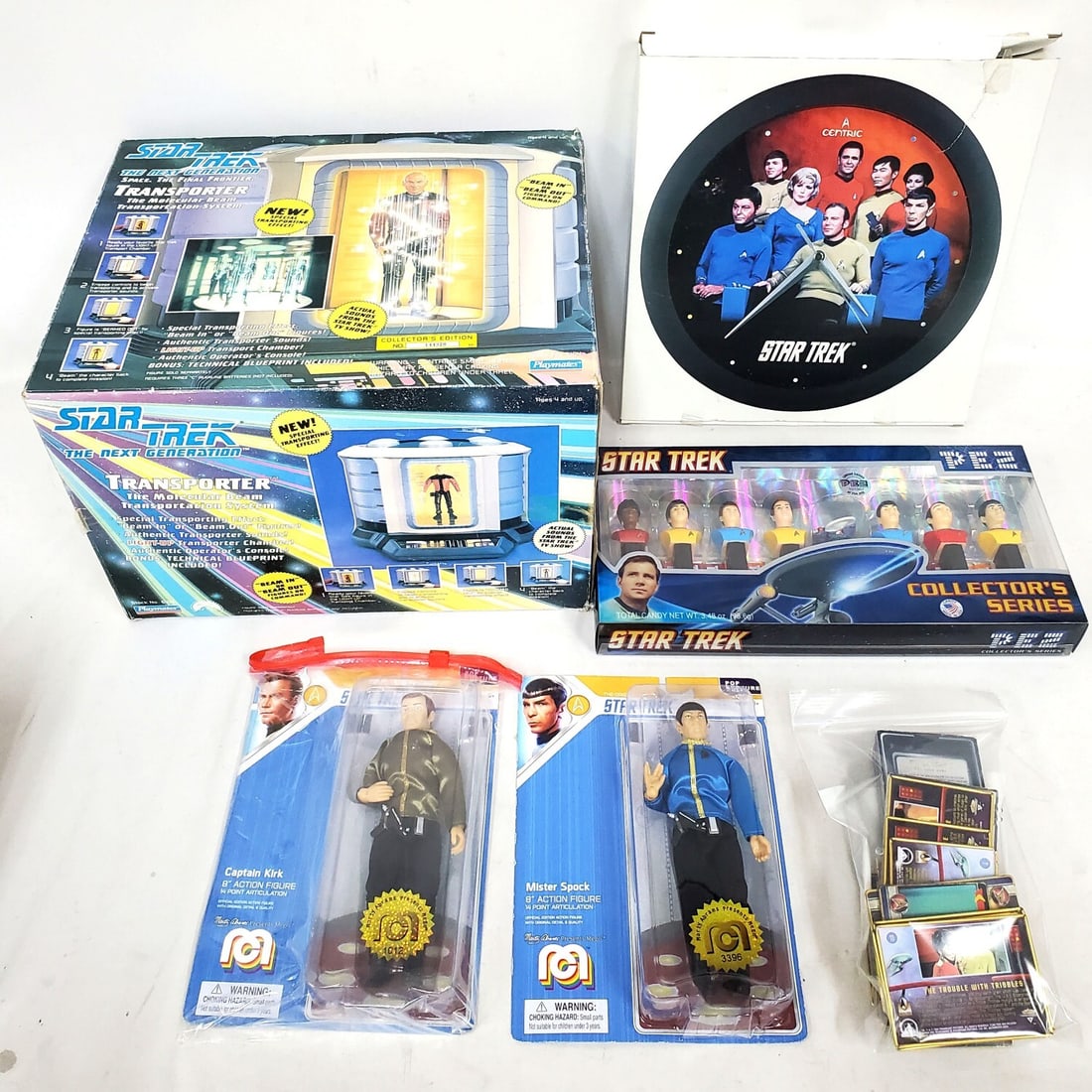 Large Lot of Star Trek Memorabilia: Large Lot of Star Trek Memorabilia Including A Star Trek: The Next Generation Collector's Transporter Playset, A Vintage 1992 Centric Star Trek Wall Clock, A PEZ Collector's Series Set, 1991 Impel Sta