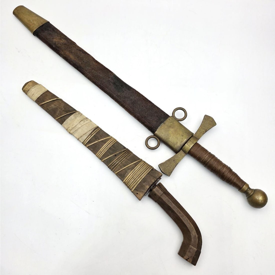 2 Daggers: 2 Daggers.Condition: Generally Good, As Found. Dimensions: Longest-22.5"Provenance: From a Long Island, NY Home. Please note the absence of a Condition Report does not imply that there are no conditio