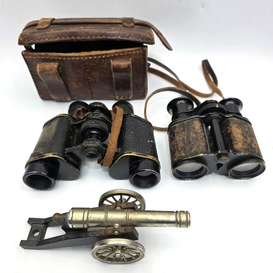 Lot of 2 Old Binoculars: Lot of 2 Old Binoculars. 1 in Original Leather Case. Along w/ 1 Other Item. Condition: As Found. Dimensions: Various Sizes. Provenance: From a Long Island, NY Home. Please note the absence of a