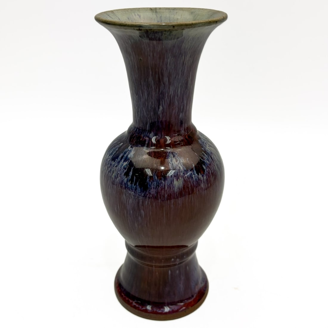 Chinese Flambe Glazed Porcelain Vase: Chinese Flambe Glazed Porcelain Vase. Condition: Generally Very Good. Dimensions: H-7.5" x Dia-3.25". Provenance: From a Long Island, NY Home. Please note the absence of a Condition Report does not im