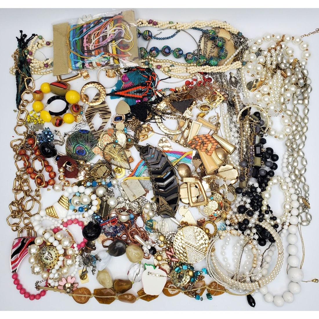 Large Bag Lot of Costume Jewelry: Large Bag Lot of Costume Jewelry. Untested. Condition: Generally Good, As Found. Dimensions: Various Sizes. Provenance: From a Long Island, NY Home. Please note the absence of a Condition Report does