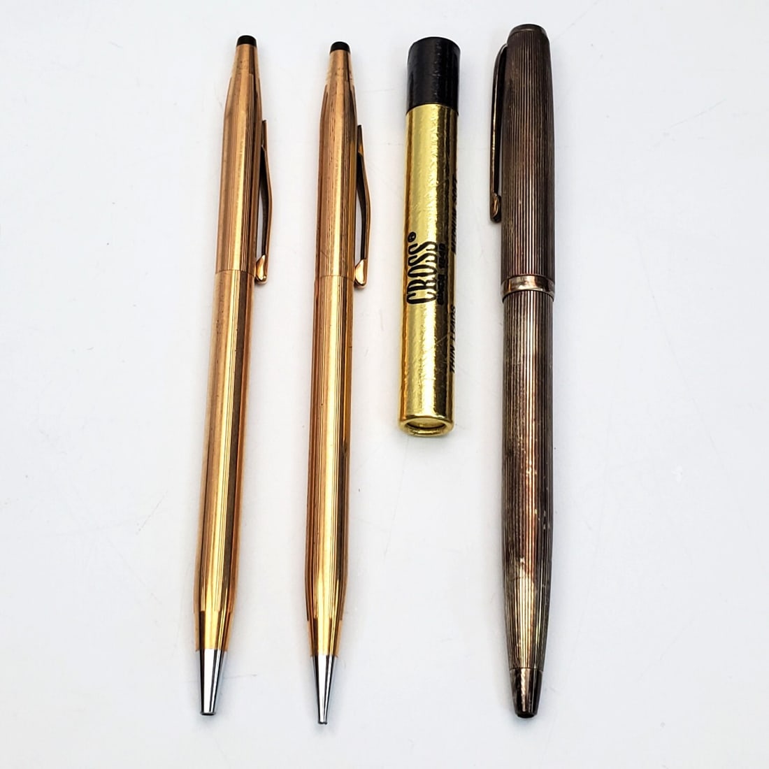 Lot of 3 Vintage Pens Including Sterling Silver: Lot of 3 Vintage Pens Including 1 Sterling Silver Pen & 2 Pens by "Cross". Along w/ Cross Thin Lead Pencil Refills. Condition: Generally Good. Dimensions: Longest-L-5.25". Provenance: From a Long Isla