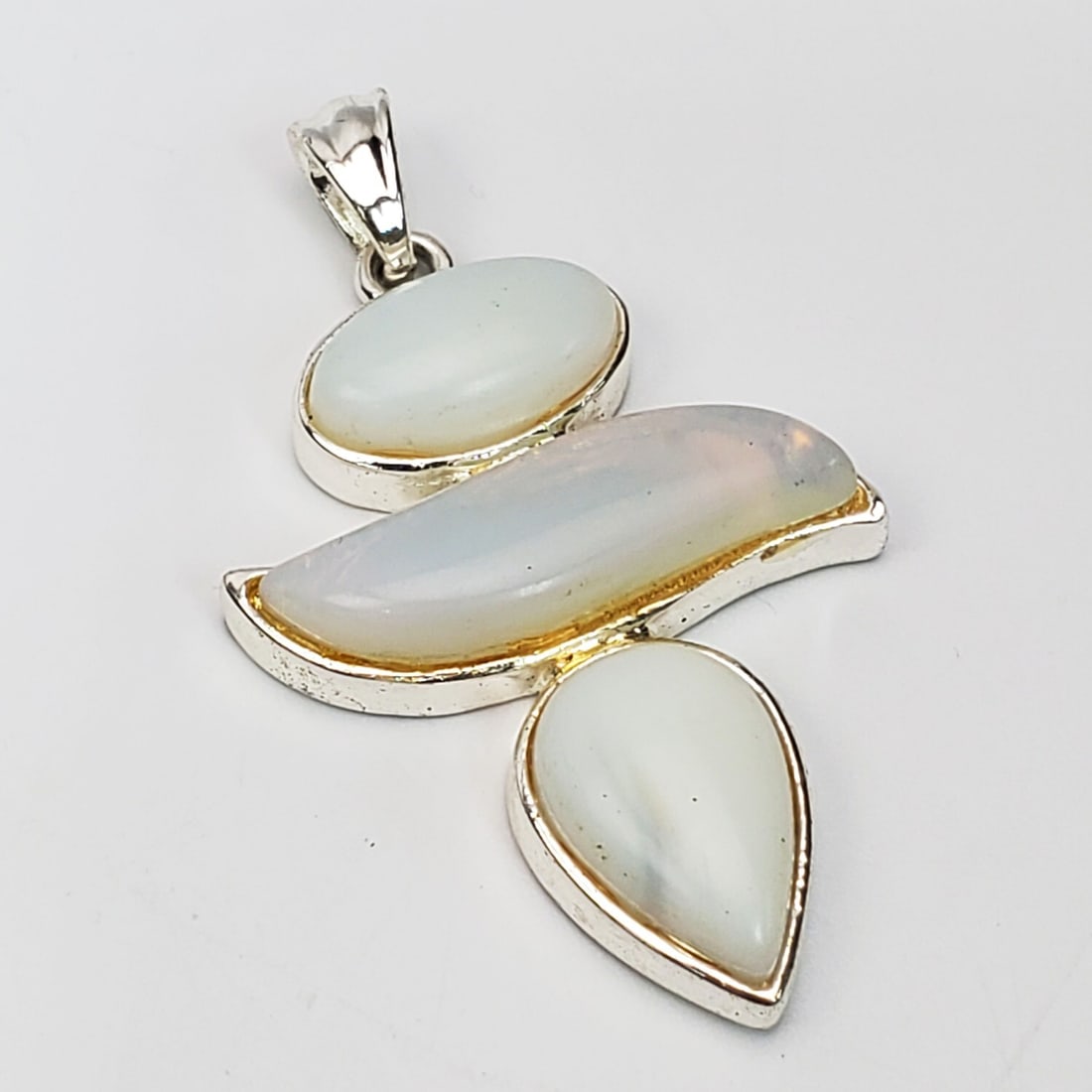 Unusual Large Sterling Silver Pendant: Unusual Large Sterling Silver Pendant. Condition: Generally Good. Dimensions: H-2.5" x L-1.3". Gross Weight: 22g/0.7ozt. Provenance: From a Long Island, NY Home. Please note the absence of a Condition