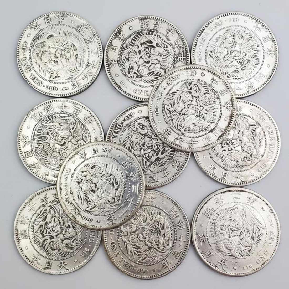 Lot of 11 Japanese Yen Coins: Lot of 11 Japanese Yen Coins. Condition: Generally Good. Dimensions: Each Dia- 1.5". Provenance: From a Long Island, NY Home.Please note the absence of a Condition Report does not imply that there are