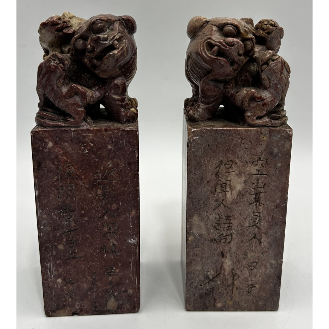 Pair of Chinese Carved Stone Seals Stamps: Pair of Chinese Carved Stone Seals Stamps w/ Figures of Foo Dogs on Top. Condition: Generally Good. Dimensions: Each-H-7". Provenance: From a Long Island, NY Home. Please note the absence of a Conditi