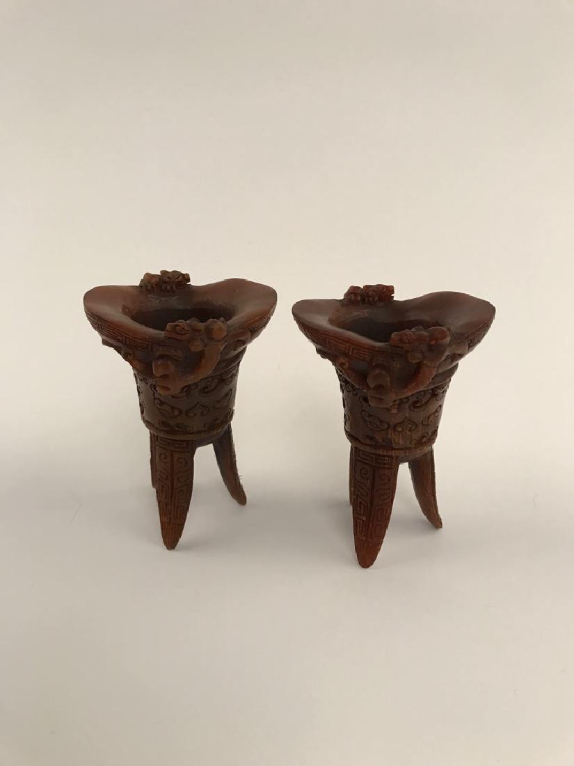 Pair of Chinese Ox Horn Carved Wine Cups: Pair of Chinese Ox Horn Carved Wine Cups 4-1/4" H X 3" W, 0.6 lb Shipping: We are able to pack and ship this item to an address in the United States for $30.00 via UPS Ground or USPS Priority Mail. Tr