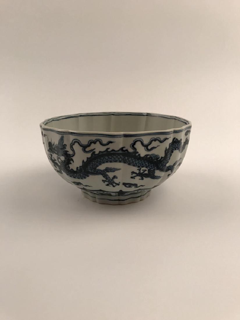 Chinese Blue and White Dragon Bowl with Xuande Mark: Chinese Blue and White Dragon Bowl with Xuande Mark 4" H X 7-1/2" Diam., 7.8 Lbs Shipping: We are able to pack and ship this item to an address in the United States for $30.00 via UPS Ground or USPS P
