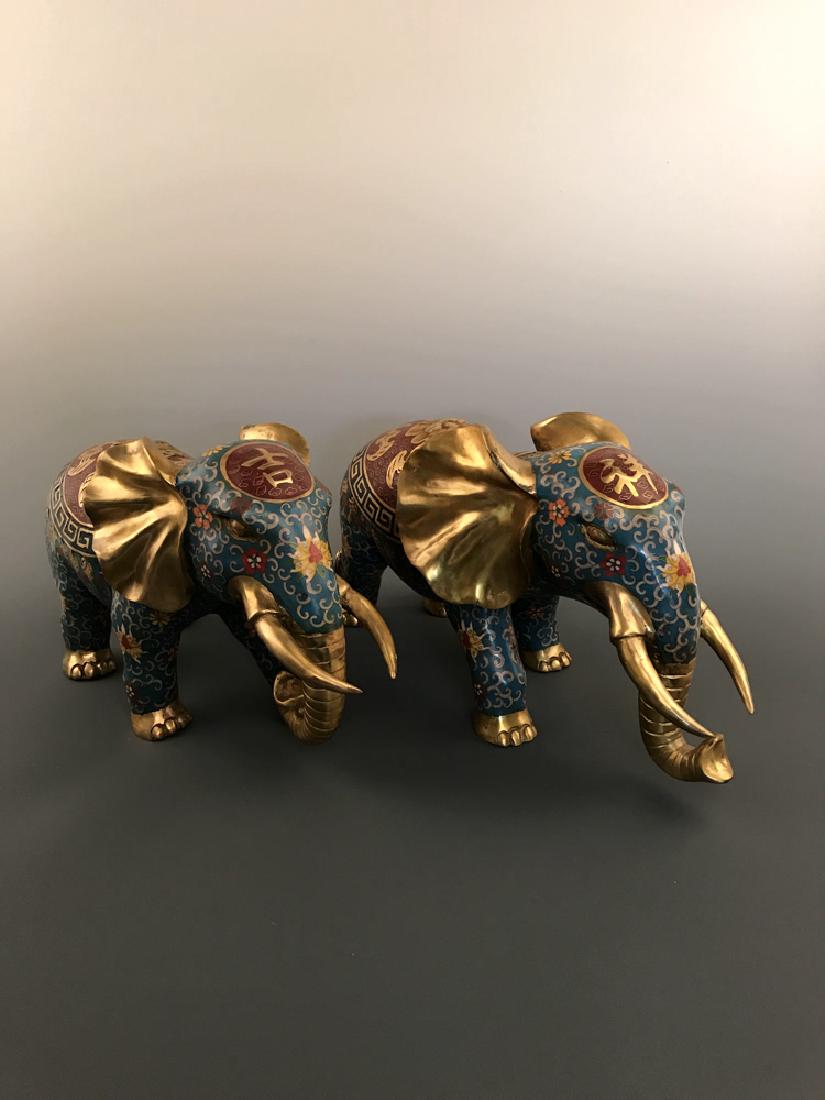Pair Chinese Cloisonne Elephant with Qianlong Mark: Pair Chinese Cloisonne Elephant with Qianlong Mark 9.5" H X 16.25" L x 8" W, 2.2 lbs Shipping: We are able to pack and ship this item to an address in the United States for $90.00 via UPS Ground or US