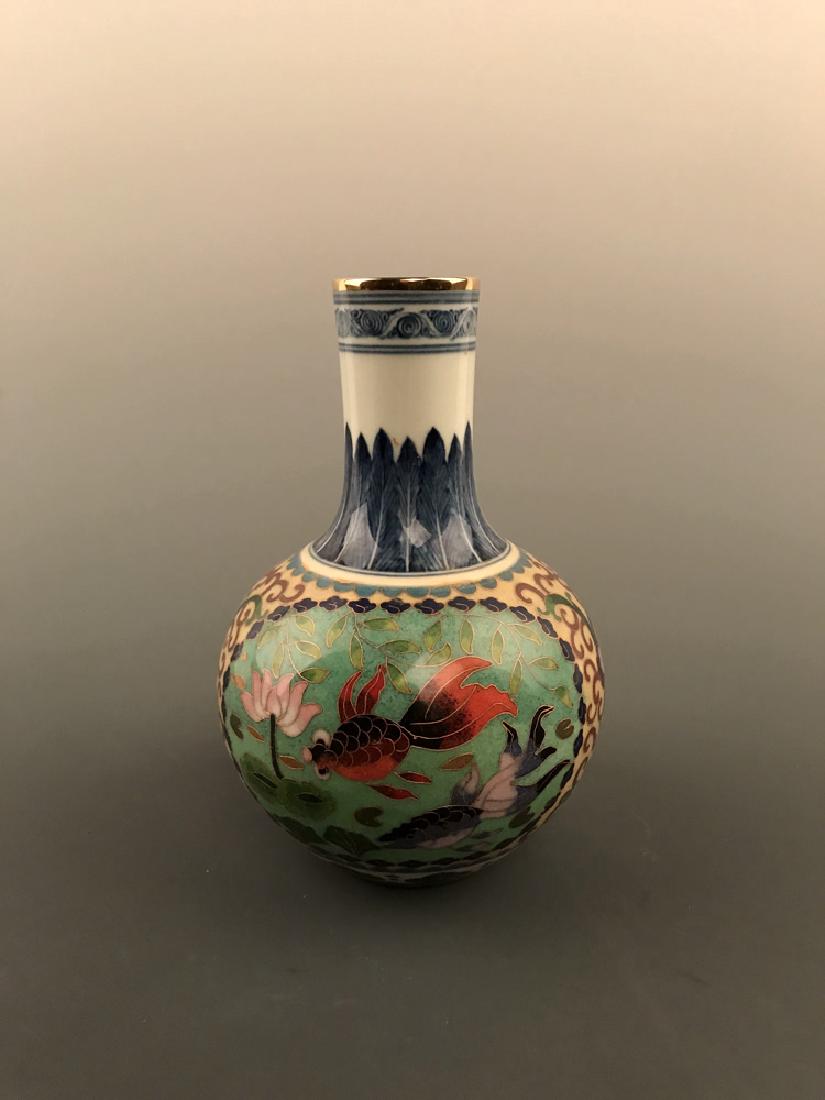 Chinese Cloisonne Vase with Fish Design: Chinese Cloisonne Vase with Fish Design 7.5" H X 5" W. 1.2 lb Shipping: We are able to pack and ship this item to an address in the United States for $30.00 via UPS Ground or USPS Priority Mail. Track
