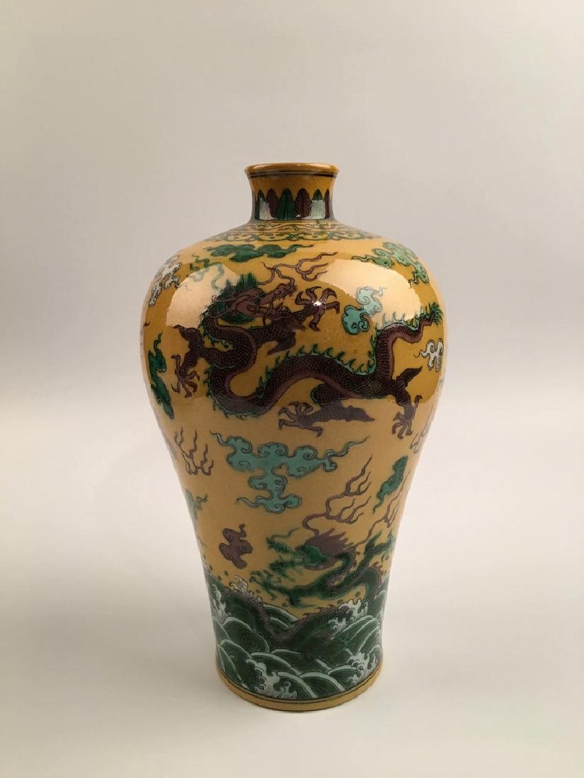 Chinese Wucai Dragon Porcelain Vase with Qianlong Mark: Chinese Wucai Dragon Porcelain Vase with Qianlong Mark 14-1/2" H X 8" W, 5.8 Lb Shipping: We are able to pack and ship this item to an address in the United States for $45.00 via UPS Ground or USPS Pr