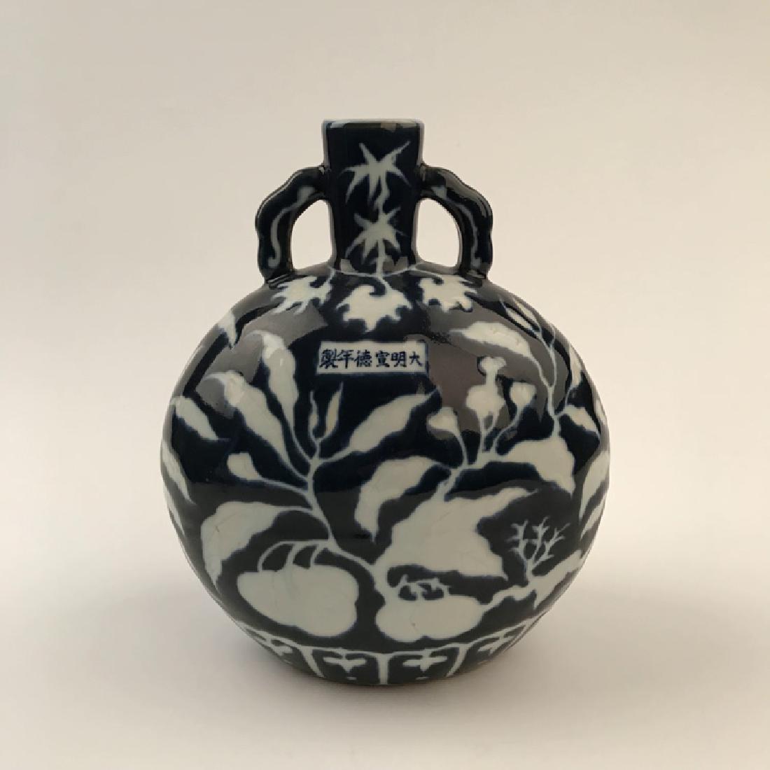 Chinese Blue and White Moon Flask Vase: Chinese Blue and White Moon Flask Vase 10-1/2" H x 8-1/2" W, 4.6 Lbs Shipping: We are able to pack and ship this item to an address in the United States for $35.00 via UPS Ground or USPS Priority Mail