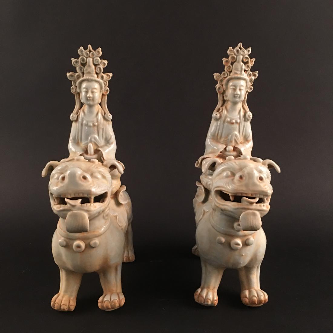 A Pair of Chinese Celdon Porcelain 'Buddha on Ruishou': A Pair of Chinese Celdon Porcelain 'Buddha on Ruishou' Statues 12'' H, 9.5'' W; 8.4 lb Shipping: We are able to pack and ship this item to an address in the United States for $50.00 via UPS Ground or 