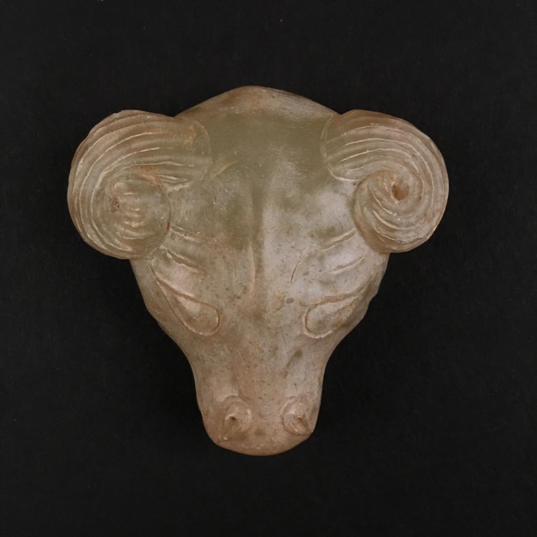 Chinese Archaic Jade Ram Head: Chinese Archaic Jade Ram Head 1-5/8'' H, 1-7/8'' W; 39 g Shipping: We are able to pack and ship this item to an address in the United States for $20.00 via UPS Ground or USPS Priority Mail. Tracking i
