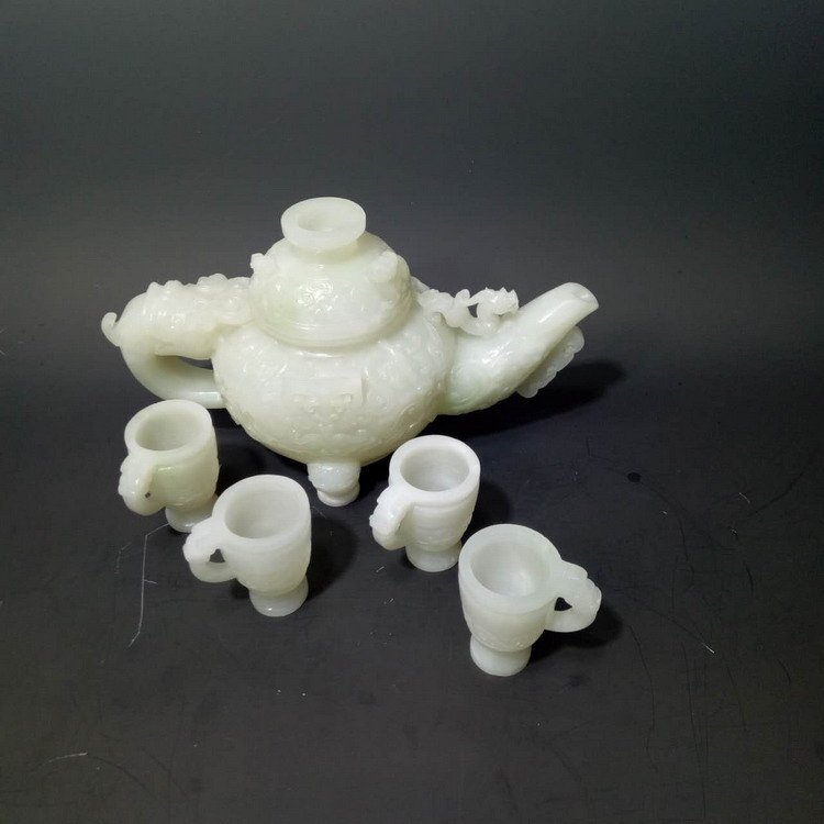 He Tian White Teapot Set: He Tian White Teapot Set, Teapot: 23cm H X 13.5cm W, 1489g & Tea Cup: 5.8cm H X 3.8cm W, 340g Shipping: We are able to pack and ship this item to an address in the United States for $50.00 via UPS Gro