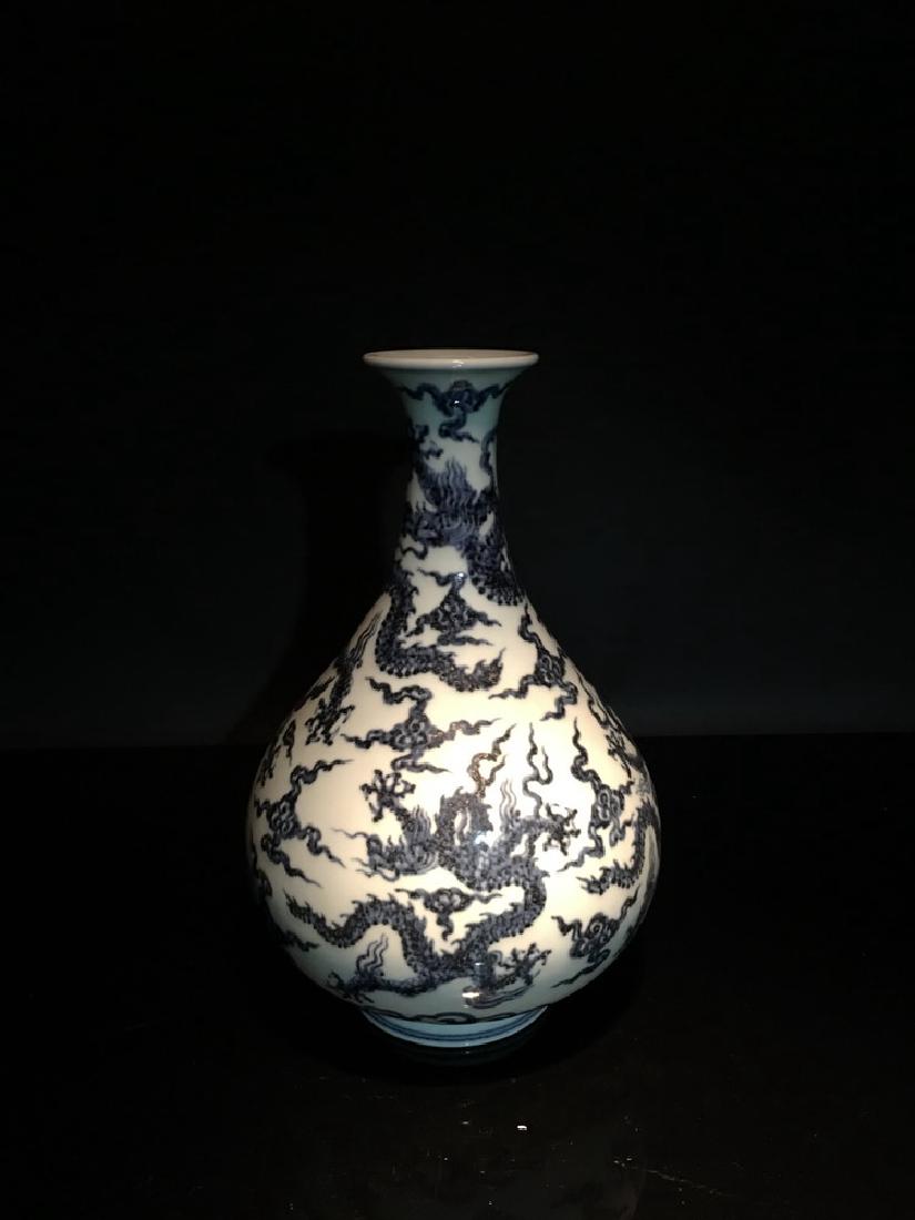 Chninese Blue and White Dragon Vase with Xuande Mark: Chninese Blue and White Dragon Vase with Xuande Mark 11-3/4" H X 7" W, 3.2 Lbs Shipping: We are able to pack and ship this item to an address in the United States for $45.00 via UPS Ground or USPS Pri
