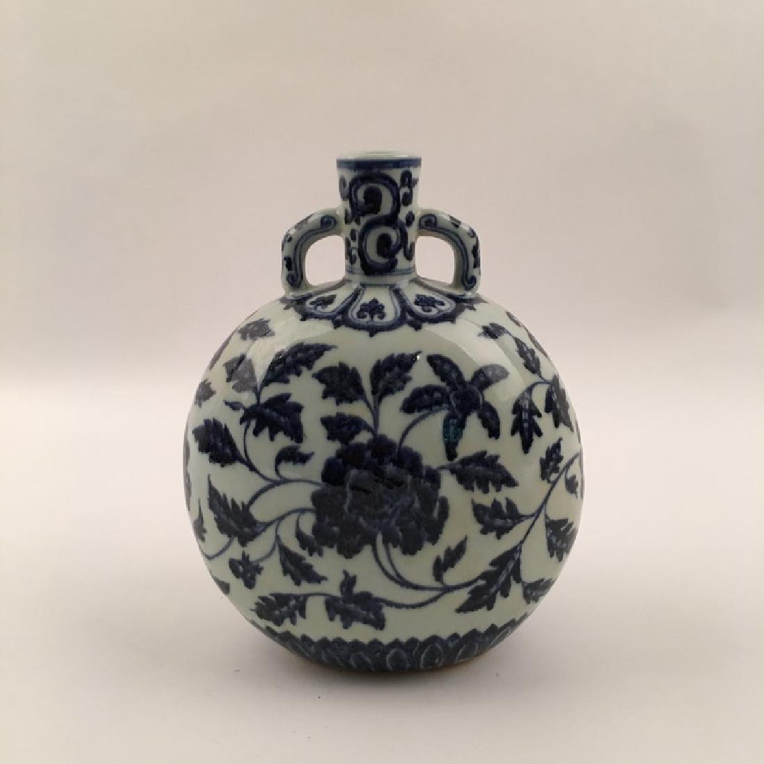 Chinese Blue and White Moon Flask Vase: Chinese Blue and White Moon Flask Vase with Xuande Mark 11" H X 9" Diam., 4 Lbs Shipping: We are able to pack and ship this item to an address in the United States for $40.00 via UPS Ground or USPS Pr