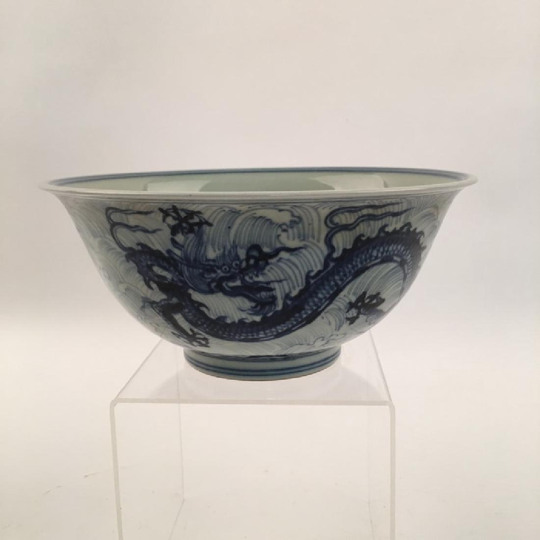 Fine Chinese White and Blue Dragon Bowl: Fine Chinese White and Blue Dragon Bowl with Xuande Mark 4" H X8-1/2" Diam., 1.6 Lbs Shipping: We are able to pack and ship this item to an address in the United States for $35.00 via UPS Ground or US