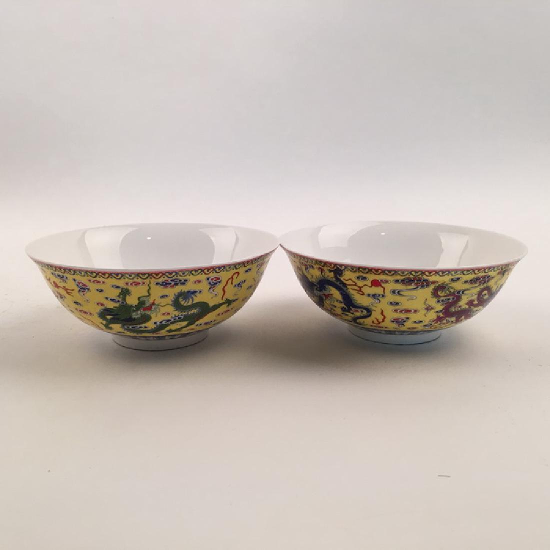 Pair Famille Rose Dragon Bowl: Pair Famille Rose Dragon Bowl with Qianlong Mark 2-1/2" H X 6-1/4" Diam., 1 Lbs Shipping: We are able to pack and ship this item to an address in the United States for $30.00 via UPS Ground or USPS Pr