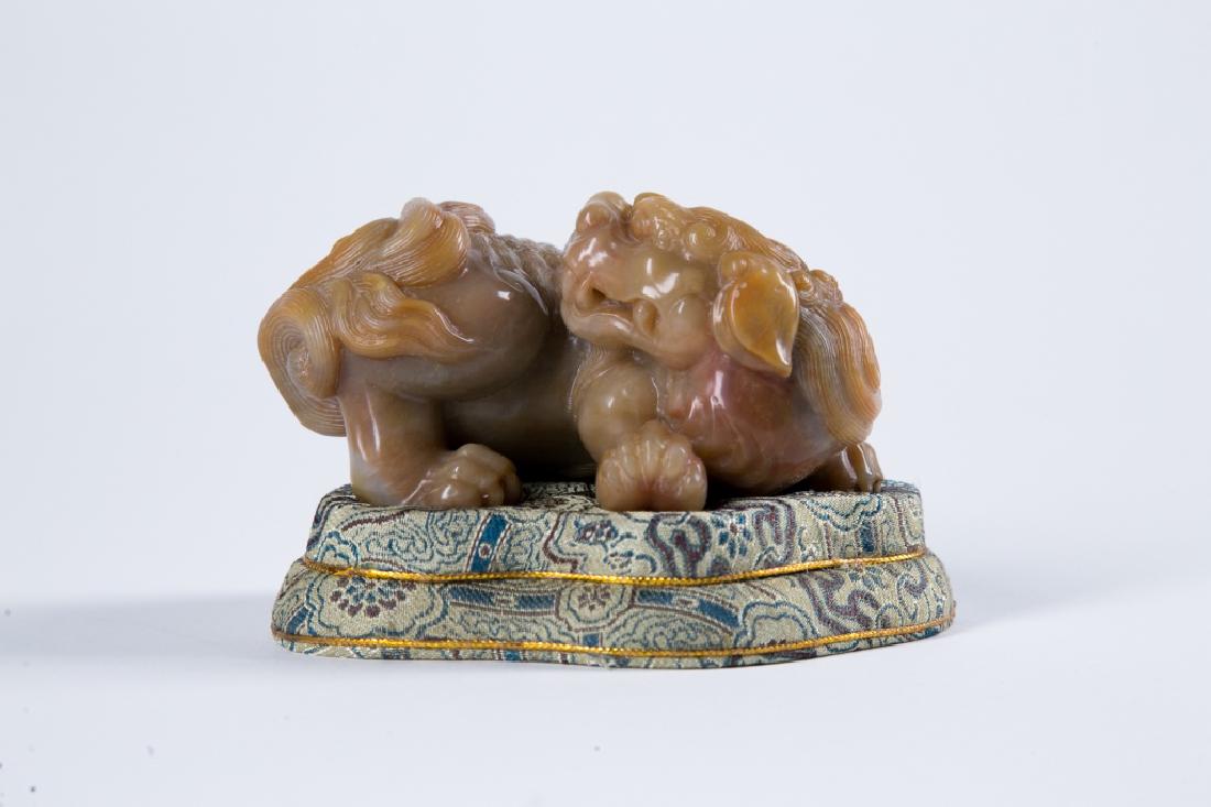 A SOAPSTONE 'LION' PAPERWEIGHT (1 of 10)