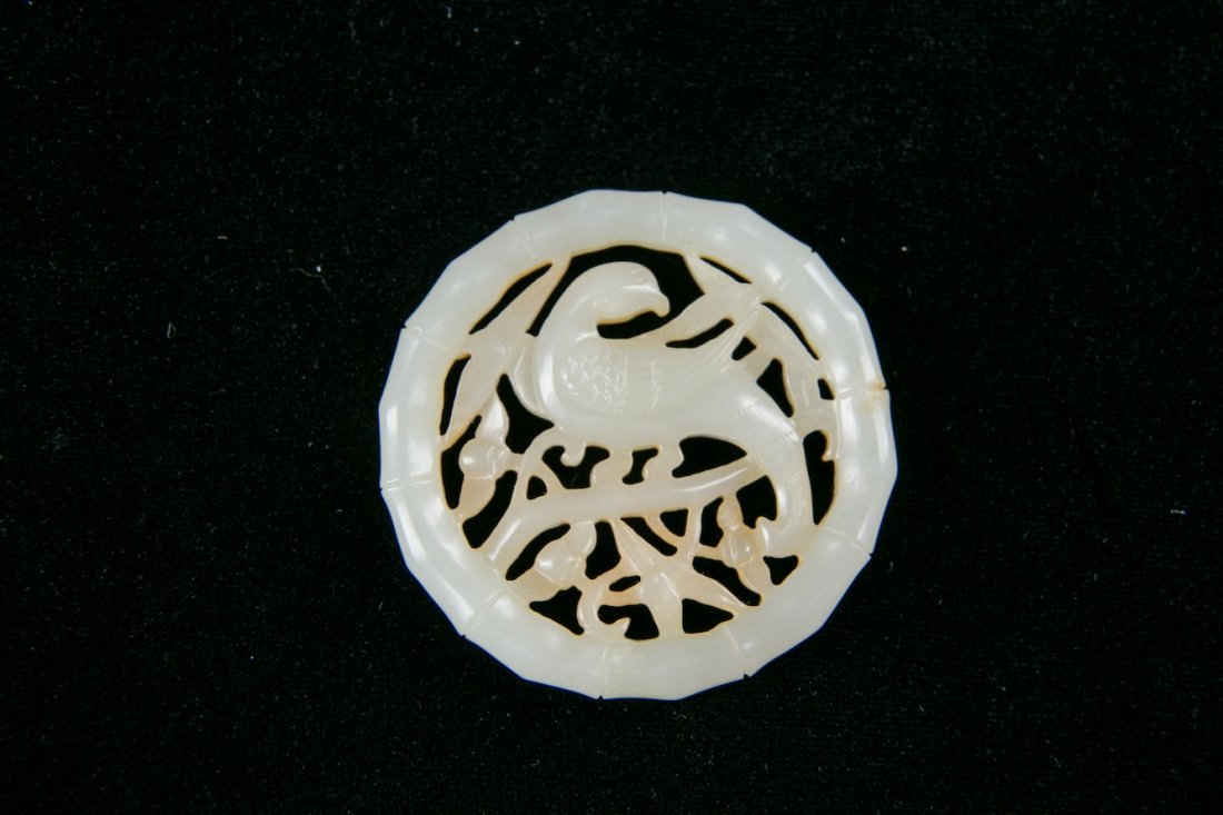 A CHINESE ROUND JADE PLAQUE, QING DYNASTY (1 of 10)