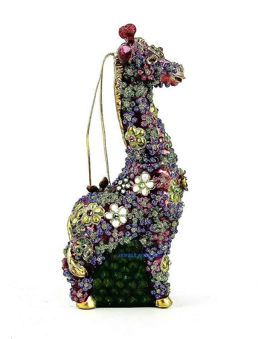 JAY STRONGWATER MILLE FIORI GIRAFFE GLASS CHRISTMAS: JAY STRONGWATERMILLE FIORI GIRAFFE GLASS ORNAMENTColor: JEWELFrom MILLE FIORI CollectionApprox. 3" Wide x 6 3/4" Tall x 1 3/4" DeepMade of Glass withMulticolor SWAROVSKI CrystalsSTAND IS NOT INCLUDEDB