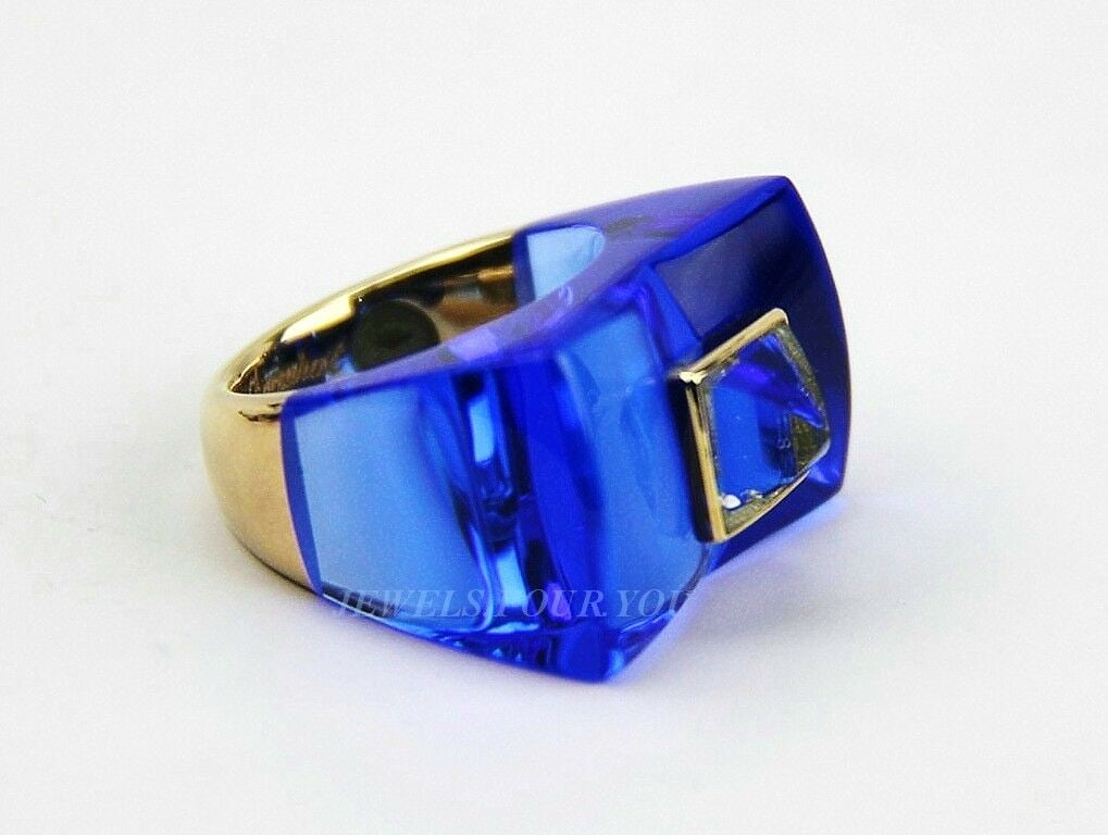 BACCARAT 18K SOLID GOLD GUET APENS AQUAMARINE SAPPHIRE RING: Made in France BACCARAT18K SOLID YELLOW GOLD FRAME AND BOTTOM OF THE RING (Solid)GUET APENS AQUAMARINE RINGSAPPHIRE COLOR CRYSTALWith original tag attachedRetail Price $1,995.00Stone is Full-Lead CRYS