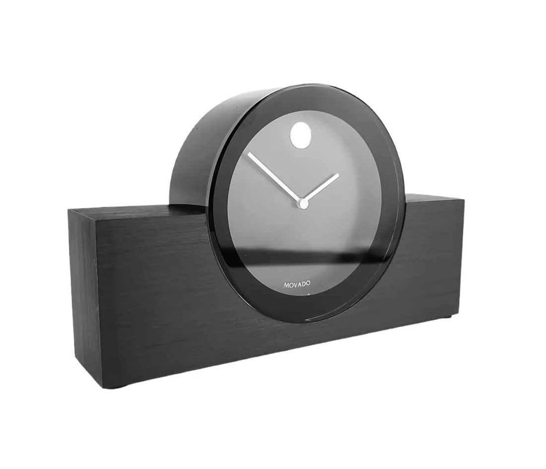 MOVADO BRAND NEW IN ORIGINAL BOX LARGE ROUND CLOCK ON STAND MODEL: TBL000313M: MOVADOBRAND NEW IN ORIGINAL BOX LARGE ROUND CLOCK ON STANDMODEL: TBL000313MTotal Size: 8" Long x 5" TallStand: 8" Long x 2.75" Tall x 1.75" DeepClock: 4.5" Diameter x 1.75" DeepHeavy - 3.10 LbWILL NEE