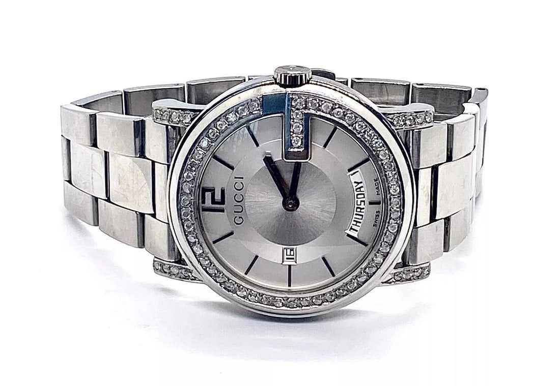 Mint Unisex Gucci White Dial 2 to 2.3 ct .aprx. real White Diamons: Mint UNISEX Gucci with around 2 and 2.3 total ct. aprox. Real Great Quality White Diamonds Watch 100% AUTHENTIC #65 WILL FIT UP TO 6,3/4" WRISTThey are 70 small Genuine White Good Quality and Color Di