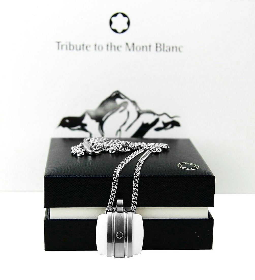 MONTBLANC TRIBUTE TO Mont Blanc WHITE AGATE NECKLACE: MONTBLANCTRIBUTE TO MONTBLANC NECKLACENO BOX, ORIGINAL MONTBLANC TAGSCLASSIC COLLECTIONSOLID STAINLESS STEELWITH WHITE AGATEChain: 22" LongPendant: 22 mm x 20 mmNO BOX, ORIGINAL MONTBLANC TAGS & BOOKL