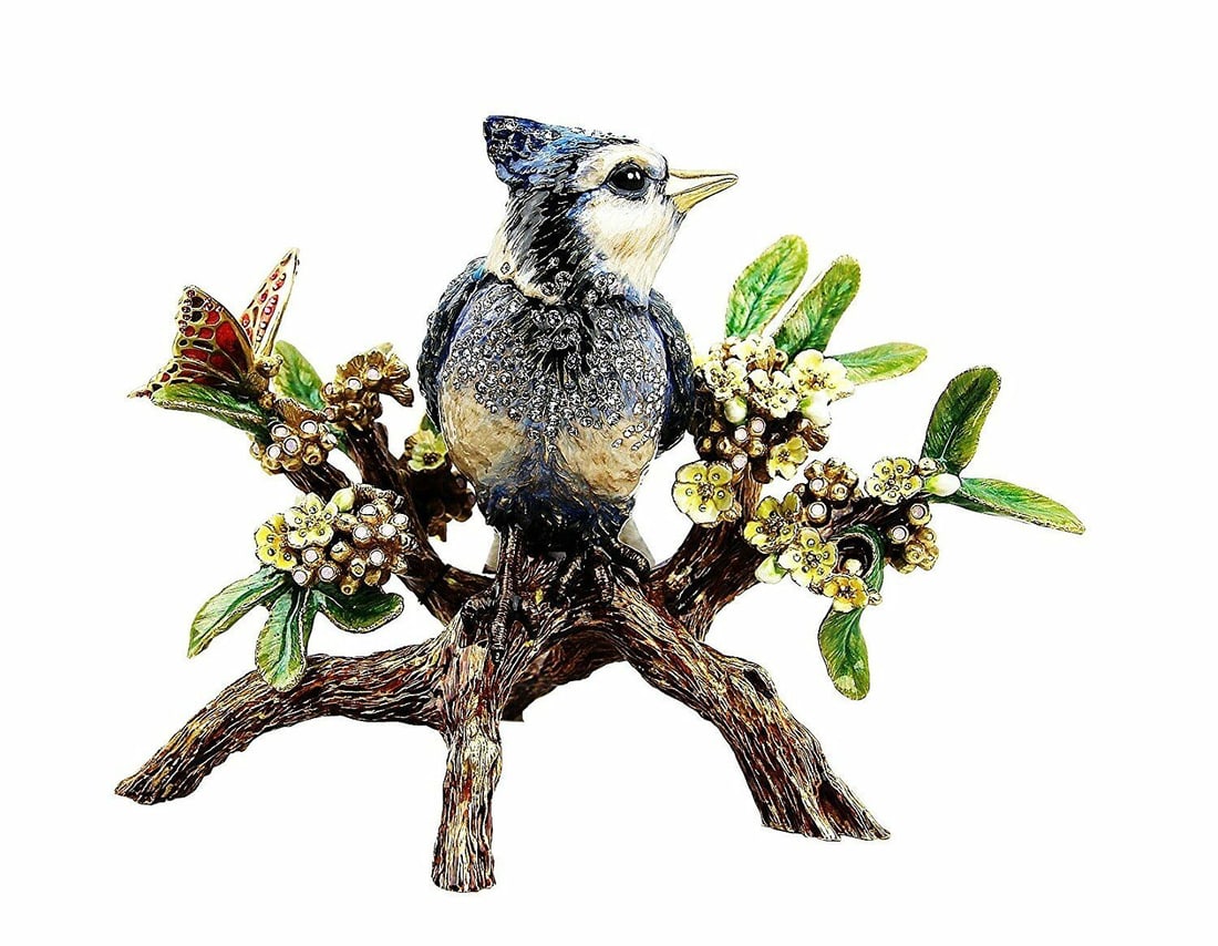 JAY STRONGWATER ANDERSON BLUE JAY ON BRANCH FIGURINE with SWAROVSKI CRYSTALS: JAY STRONGWATERLARGE BLUE JAY ON BRANCH FIGURINEFrom FLORA & FAUNA CollectionName: ANDERSONColor: NATURALHandpainted Enamel over metalHand-set Multicolor Swarovski Crystals.6.25" Deep x 7" Tall x 9.25