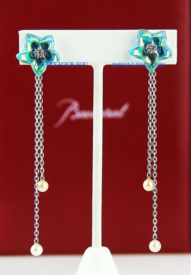 BACCARAT BLOSSOM ST SILVER IRIDESCENT TURQUOISE PEARLS CLIP-ON EARRINGS: MADE IN FRANCE. 100% AUTHENTIC BACCARATBLOSSOM STERLING SILVER CLIP-ON EARRINGS Main Stone: Full-Lead Clear Crystal, IRIDESCENT TURQUOISE (17 mm) With TWO PERLS BRAND NEW, NO BOX. Retail Price: $610.0