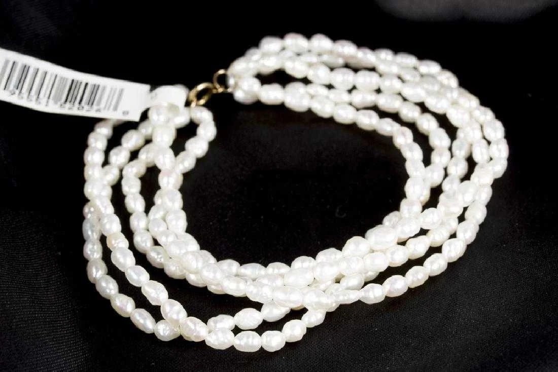 Five Strand Fresh Water Pearl Bracelet & 14Kt Gold Brand New 100% Authentic: Five Strand Fresh Water Pearl Bracelet & 14Kt Gold Brand New 100% Authentic Retail $199.00Five strands of freshwater pearls with a 14kt yellow gold clasp. 7.5" in length. 17.6gms