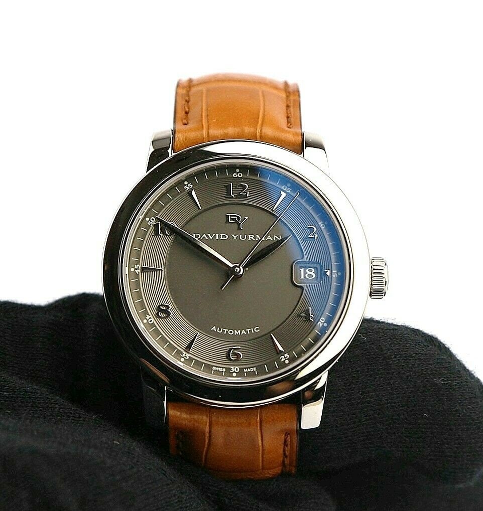 DAVID YURMAN STAINLESS STEEL & ST. SILVER WATCH COGNAC: DAVID YURMAN 100% BRAND NEW, NEVER WORN 100% AUTHENTIC This is an UNISEX Model. ALL BOXES AND PAPERS INCLUDED STAINLESS STEEL & STERLING SILVER CABLE. BROWN ALLIGATOR BAND; SAPPHIRE CRYSTAL ON FACE; B