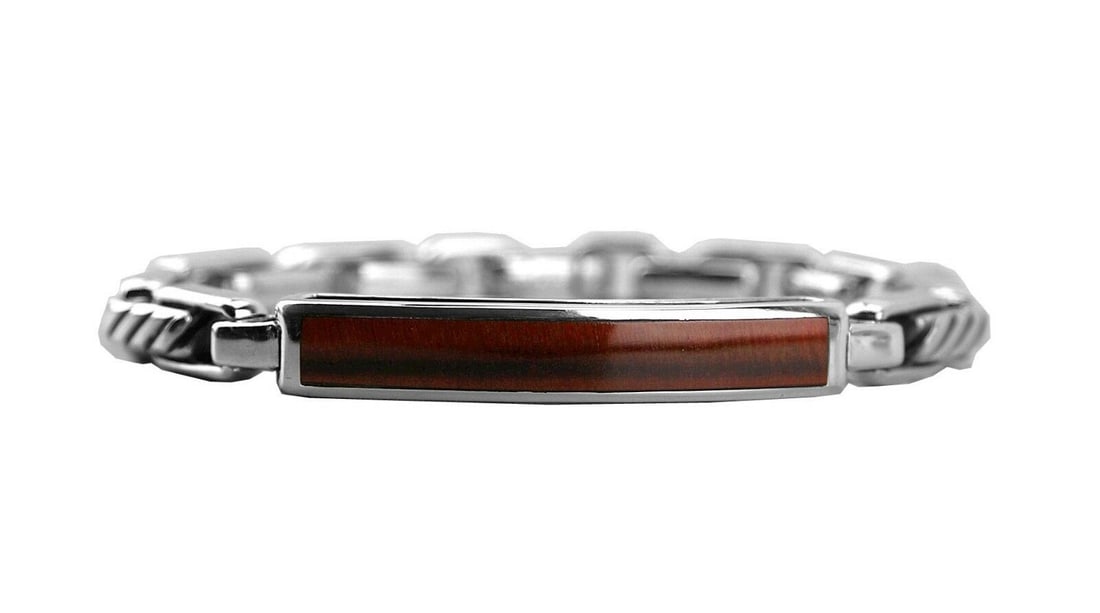 DAVID YURMAN ST. SILVER RED TIGER EYE 4mm MODERN CABLE ID BRACELET 23B: DAVID YURMANGORGEOUS SOLID STERLING SILVER BRACELET # 23BMODERN CABLE IDWITH RED TIGER EYE INLAYSIZE: MediumMADE OF .925 STERLING SILVER8.5" Long15 mm Wide x 6.7 mm ThickORIGINAL BOX, POUCH &