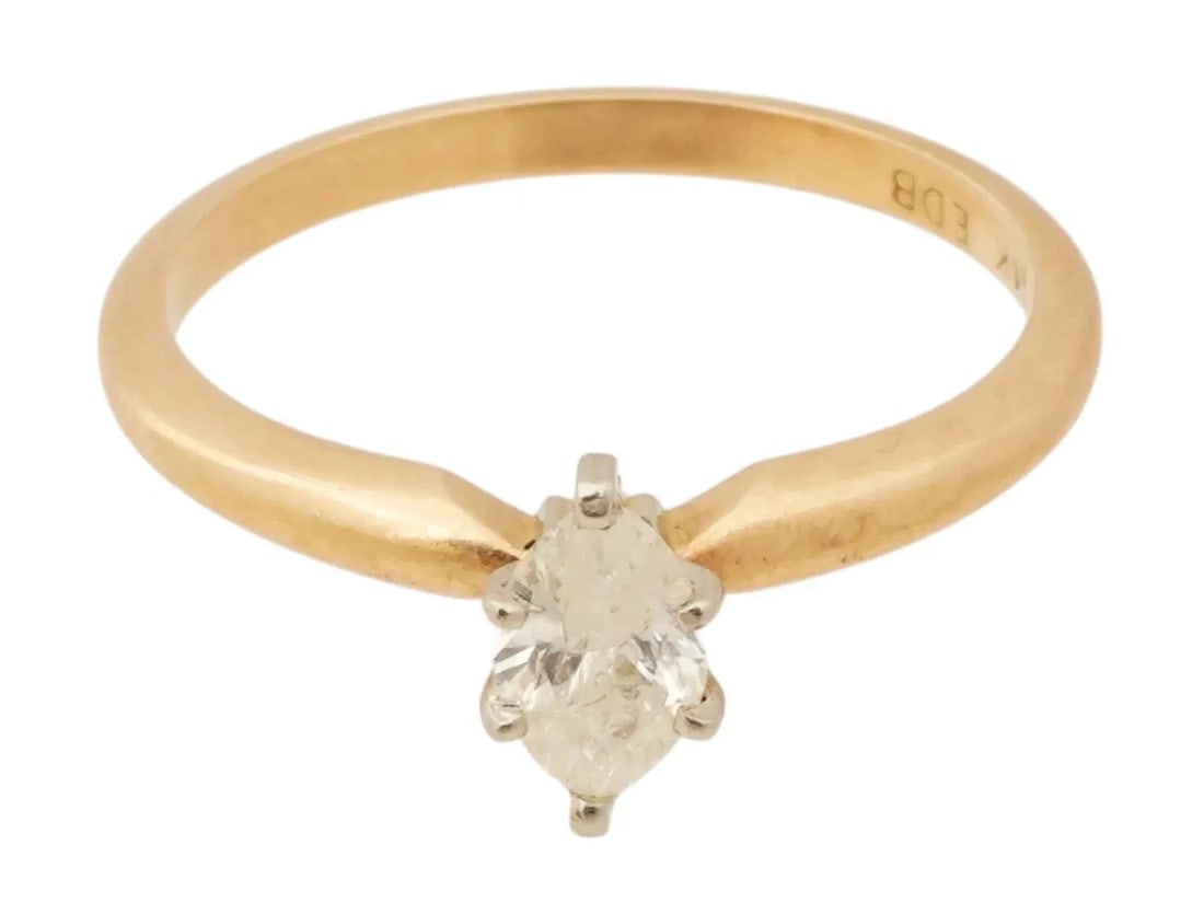 A vintage 14K yellow gold engagement ring. Set with a marquise-cut diamond 2.1gm: A vintage 14K yellow gold engagement ring. Set with a marquise-cut diamond 2.1g 100% AuthenticConditionPre-owned - GoodSeller Notes“Good Vintage Condition. Refer to Photos.”Materials sourced f