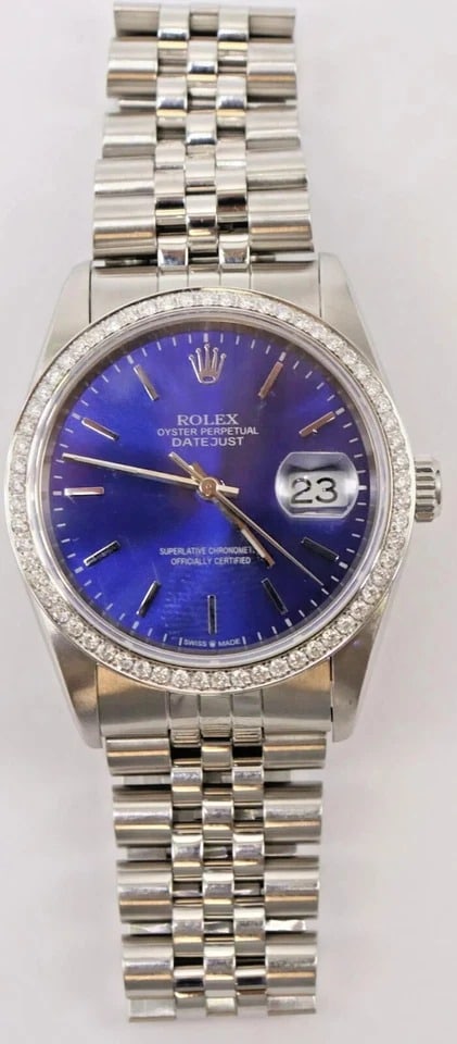 Rolex Datejust Turn-O-Graph 16264 S S. DIAMMOND BEZEl Wristwatch. 36MM. Blue,Box: Rolex Datejust Turn o Graph 16264 Stainless Steel Wristwatch. 36MM. Dark blue dial. 100% Authentic, Swiss Made. It will fit up to 7.5 inches wrist.Aftermarket diamond bezel. Caliber - Automatic 3135. 