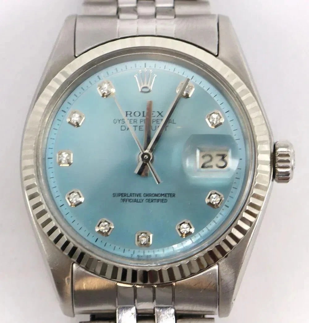 Rolex Datejust 1601 Stainless Steel and 18K Gold Bezel Light BlueWristwatch 36mm: Rolex dial Ref. with added diamond hour markers, and custom stainless steel oyster bracelet.12-Hour Dial, Date Indicator, Swiss Made, Swiss MovementDescriptions: Brand:RolexModel:DatejustReference:160