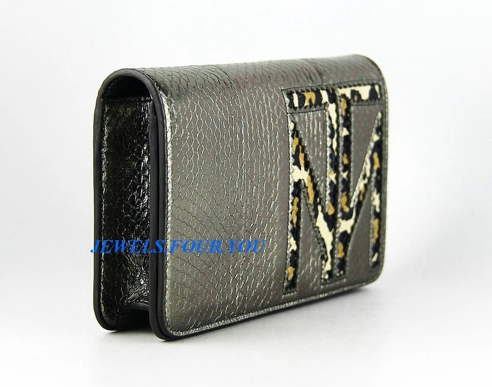 TAMARA MELLON CHIEF DESIGNER JIMMY CHOO TM ENJOY WATERSNAKE CLUTCH BAG ITALY: Tamara MellonTOP QUALITY 100% NAPPA LEATHERTM ENJOY WATERSNAKE CLUTCH BAGCompact and versatile, with monochromatic tm logo with pinking detail adds a subtle texture. It's the perfect evening bag. Pewt