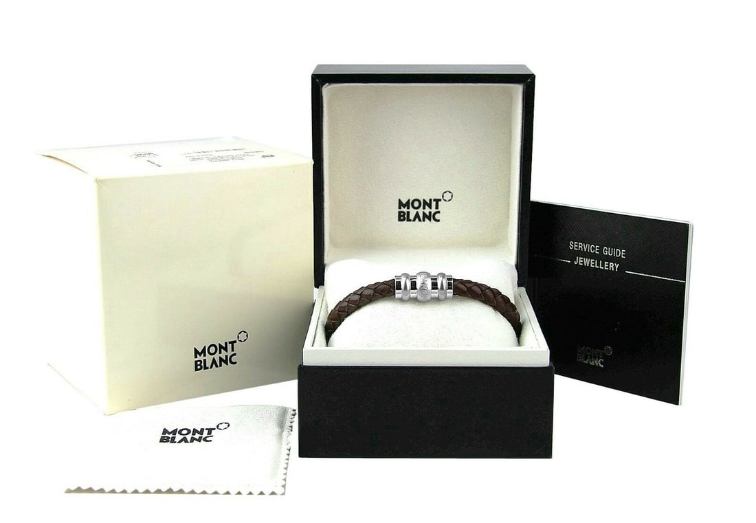 MONTBLANC ST. SILVER WOVEN BROWN LEATHER BRACELET SIZE L 106936: MONTBLANC EXTREMELY RARE!FINE JEWELRY COLLECTION AMAZING BRACELETSOLID STERLING SILVER LOCK &BROWN WOVEN LEATHER SIZE: LARGE - 7.75" LONGLOCK: 23 mm x 11 mmLeather: 6 mm Wide100% AUTHENTIC & 100% BRAN