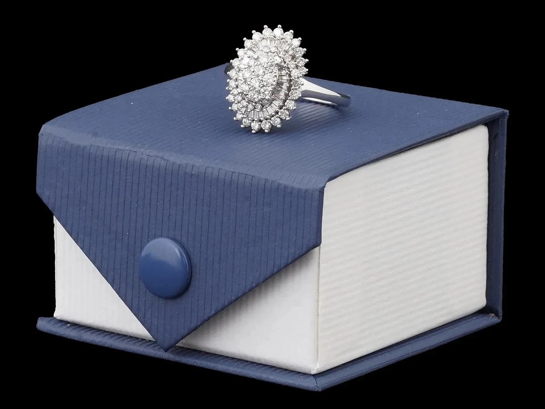 Stanning Baguette and Round Diamond Cluster Ring in 10k White Gold Over 1 cttw: Stunning Baguette and Round Diamond Cluster Ring in 10k White Gold Over 1 cttw Total Weight is 4.45 Grams Appraised over $3500 Comes with a PGL certificate.A vintage 10K white gold cluster ring. Compo