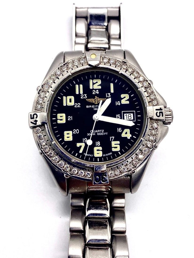 Breitling Colt 44mm Diamond Bezel Automatic Watch St. Steel Band Box #63: Breitling Colt 44mm Diamond Bezel Watch #63Features:- Ref. A57035- Stainless steel band- Original black dial- Diamond bezel- Automatic Movement- Date indicator - Fits up to 7.25" wristComes with trave