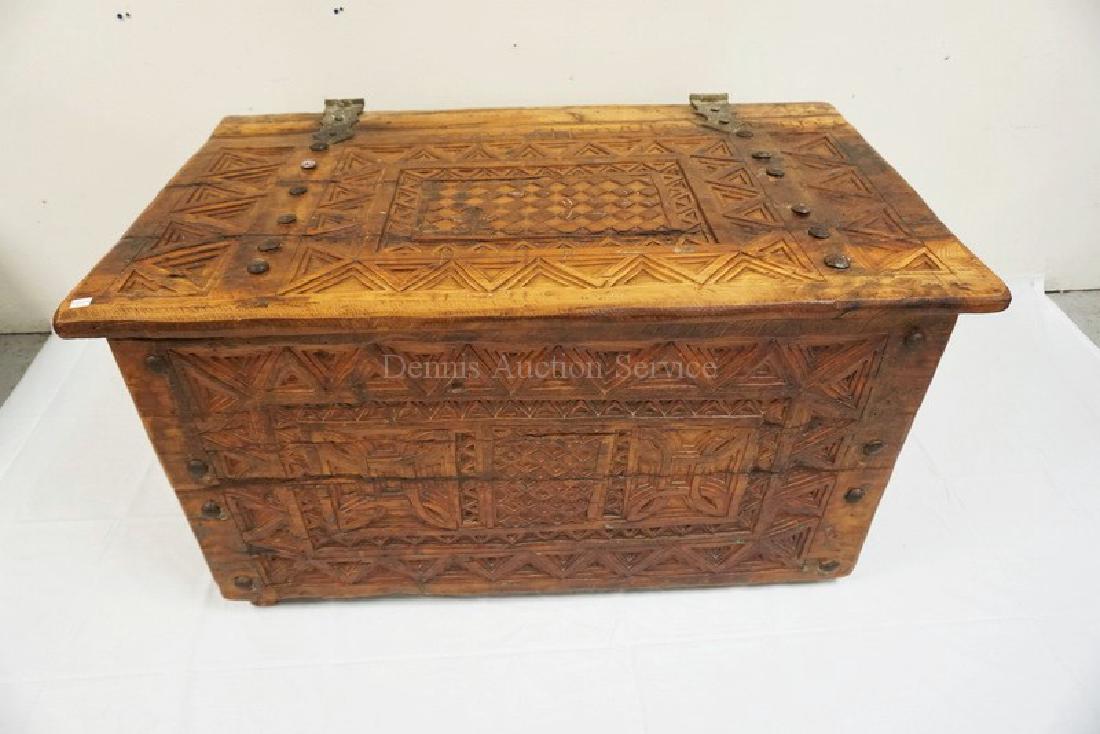 ANTIQUE INTRICATELY CARVED LIFT TOP CHEST WITH IRON (1 of 2)